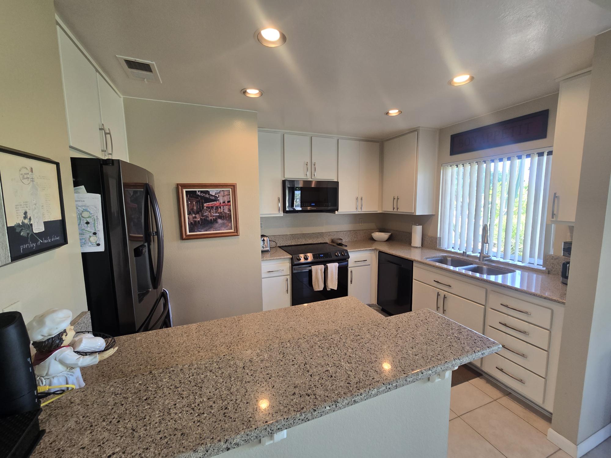 #571 – COMFORTABLE 2-BEDROOM, END-UNIT CONDO, WEST FACING PATIO WITH UPGRADES.  RENTED FOR 26-27 SEASON