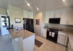 #571 – COMFORTABLE 2-BEDROOM, END-UNIT CONDO, WEST FACING PATIO WITH UPGRADES.  RENTED FOR 26-27 SEASON